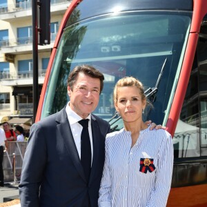 Exclusif - Christian Estrosi et sa femme Laura Tenoudji durant l'inauguration de la ligne 2 Ouest Est du tramway sur le tronçon aérien entre le CADAM et Magnan à Nice 30 juin 2018. Ce tramway est le premier au monde à utiliser un système innovant de recharge ponctuelle en station permettant une autonomie totale entre les stations aèriennes. Le SRS est un système de recharge statique par le sol mis au point par Alstom. Un tramway plus propre, plus performant avec un design signé par le niçois Ora Ito. Cet été, de 7h à 21h et jusqu'au 2 septembre les 7kms mis en service seront gratuits pour les usagers, d'ici septembre 2019 la partie souterraine sera terminée et les passagers pourront rejoindre l'aéroport en partant du port en 26 minutes.30/06/2018 - Nice