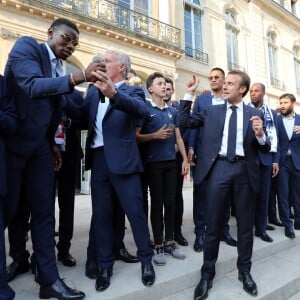 Noël Le Graët , Paul Pogba, Didier Deschamps, Alphonse Areola, Emmanuel Macron, Djibril Sidibé, Nabil Fékir, Florian Thauvin - Le président de la République Française E. Macron et la Première dame B. Macron, accueillent les joueurs de l'équipe de France (Les Bleus) et son sélectionneur D. Deschamps, le président de la Fédération Française de Football N. Le Graët et des membres de la FFF, dans les jardins du Palais de l'Elysée à Paris, le 16 juillet 2018. L'équipe de France a été sacrée Championne du Monde 2018, pour la deuxième fois de son histoire, après sa victoire en finale face à la Croatie (4-2) © Sébastien Valiela/Bestimage