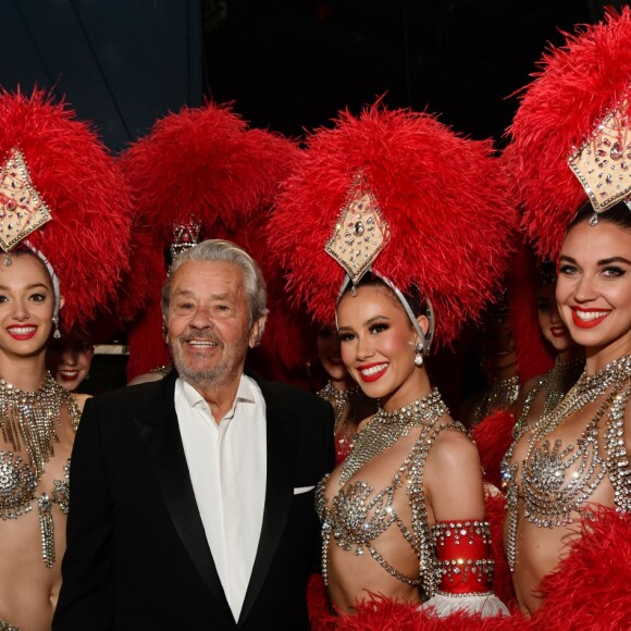 Exclusif - Alain Delon entouré par les danseuses du Moulin Rouge - Enregistrement de l'émission "Les 20 ans du Plus Grand Cabaret du Monde" dans la Salle des Etoiles à Monaco. Le 1 juin 2018. © A.Bahi-B.Bebert / Bestimage
