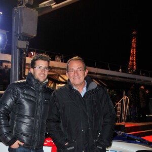 Jean-Pierre Pernaut et son fils Olivier posent devant leur Citroen C4 lors de la conference de presse de la 25eme edition du Trophee Andros a Paris le 27 novembre 2013.