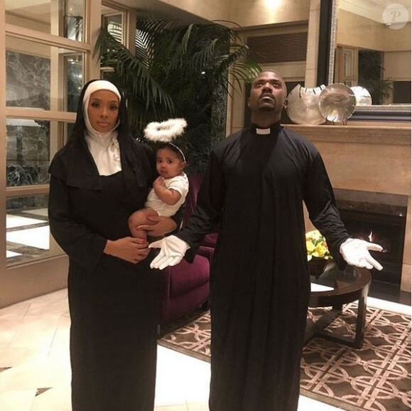 Ray J, son épouse Princess Love et leur fille Melody déguisés en prêtre, bonne soeur et ange pour Halloween. Octobre 2018.