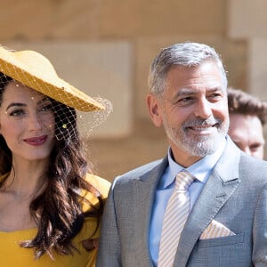 George Clooney et sa femme Amal Alamuddin Clooney - Les invités à la sortie de la chapelle St. George au château de Windsor, Royaume Uni, le 19 mai 2018.