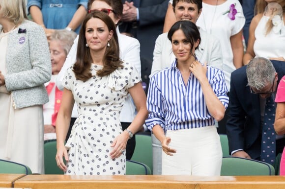 Kate Middleton, duchesse de Cambridge, et Meghan Markle, duchesse de Sussex, à Wimbledon le 14 juillet 2018.