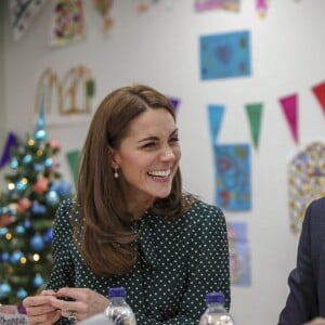 Kate Middleton, duchesse de Cambridge, et le prince William, duc de Cambridge, en visite au Centre d'aide aux sans-abri "The Passage" à Londres, le 11 décembre 2018. William est très attaché à ce lieu qu'il a découvert enfant lors d'une visite avec sa mère, Lady Di, en 1994.