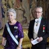 La princesse Christina de Suède et son mari Tord Magnuson au dîner des lauréats du prix Nobel au palais royal à Stockholm le 11 décembre 2018.