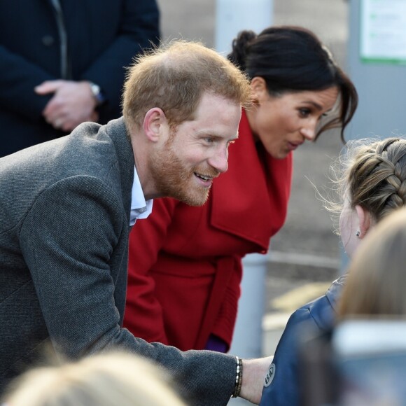 Le prince Harry, duc de Sussex, et Meghan Markle, duchesse de sussex, enceinte, lors d'une visite à Birkenhead le 14 janvier 2019.