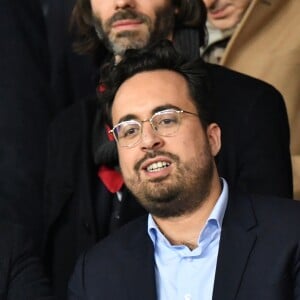 Mounir Mahjoubi, secrétaire d'État chargé du Numérique, dans les tribunes du parc des Princes lors du match de football de ligue 1, opposant le Paris Saint-Germain (PSG) contre l'Olympique de Marseille (OM) à Paris, France, le 17 mars 2019. Le PSG a gagné 3-1.