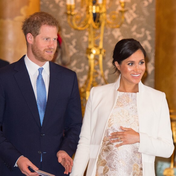 Le prince Harry, duc de Sussex, et Meghan Markle (enceinte), duchesse de Sussex - La famille royale d'Angleterre lors de la réception pour les 50 ans de l'investiture du prince de Galles au palais Buckingham à Londres. Le 5 mars 2019