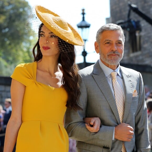 George Clooney et sa femme Amal arrivent à la chapelle S. George pour le mariage du prince Harry et de Meghan Markle au château de Windsor, Royaume Uni, le 19 mai 2018.