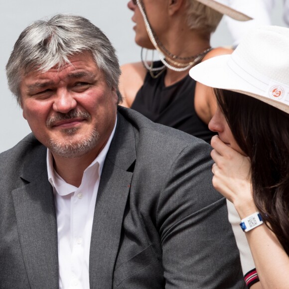 David Douillet et sa femme Vanessa dans les tribunes de Roland-Garros à Paris, le 29 mai 2019. © Jacovides-Moreau/Bestimage