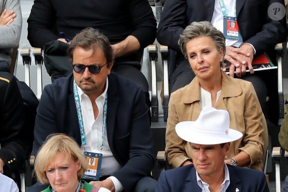 Henri Leconte et Maria Dowlatshahi dans les tribunes de Roland-Garros à Paris, le 29 mai 2019. © Jacovides-Moreau/Bestimage