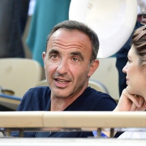 Nikos Aliagas et sa femme Tina dans les tribunes lors des internationaux de tennis de Roland Garros à Paris, France, le 31 mai 2019. © Jean-Baptiste Autissier/Panoramic/Bestimage