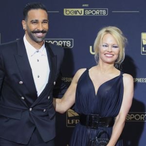 Adil Rami et Pamela Anderson au photocall de la 28ème cérémonie des trophées UNFP (Union nationale des footballeurs professionnels) au Pavillon d'Armenonville à Paris, France, le 19 mai 2019.