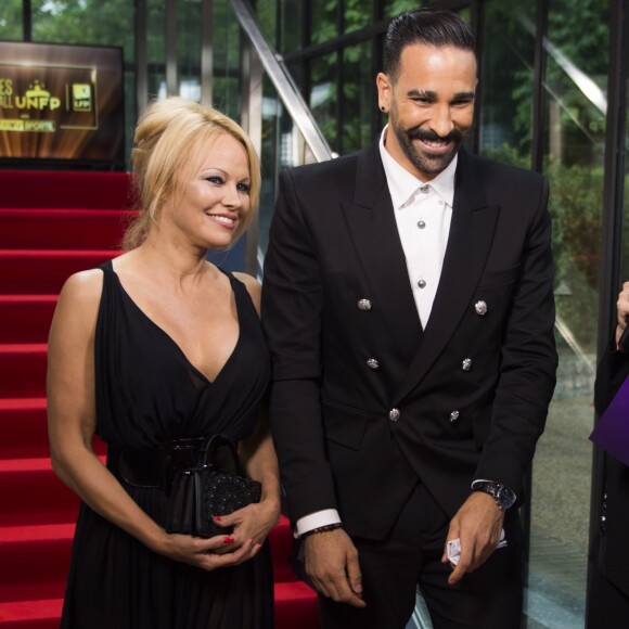 Adil Rami et Pamela Anderson arrivent à la 28ème cérémonie des trophées UNFP (Union nationale des footballeurs professionnels) au Pavillon d'Armenonville à Paris, France, le 19 mai 2019.