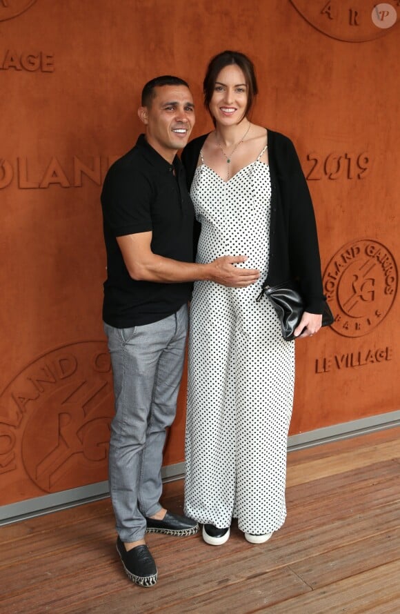 Brahim Asloum et Justine Pouget (enceinte) au village lors des internationaux de France de Tennis de Roland Garros 2019 à Paris, France, le 27 mai 2019. © Jacovides-Moreau/Bestimage