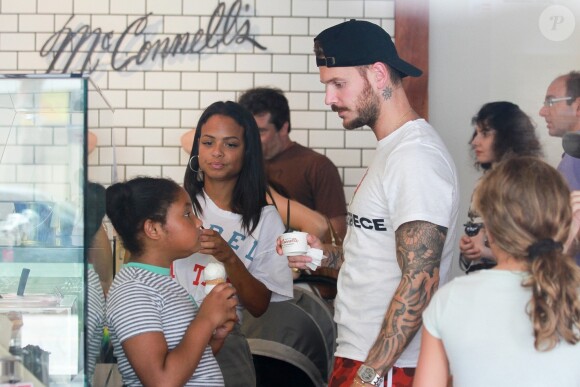 Matt Pokora, sa compagne Christina Milian enceinte et sa fille Violet Nash - Enceinte et radieuse, C.Milian se rend au glacier McConnell avec compagnon M.Pokora et sa fille V.Nash pour le goûter après avoir acheté des vêtements pour bébés. La chanteuse 'Dip it Low' et son compagnon ont annoncé sa grossesse la semaine dernière via Instagram. C'est le premier enfant du couple et le premier enfant de M.Pokora. Los Angeles, le 3 août 2019.