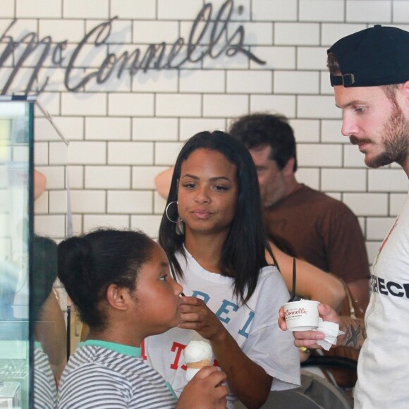Matt Pokora, sa compagne Christina Milian enceinte et sa fille Violet Nash - Enceinte et radieuse, C.Milian se rend au glacier McConnell avec compagnon M.Pokora et sa fille V.Nash pour le goûter après avoir acheté des vêtements pour bébés. La chanteuse 'Dip it Low' et son compagnon ont annoncé sa grossesse la semaine dernière via Instagram. C'est le premier enfant du couple et le premier enfant de M.Pokora. Los Angeles, le 3 août 2019.