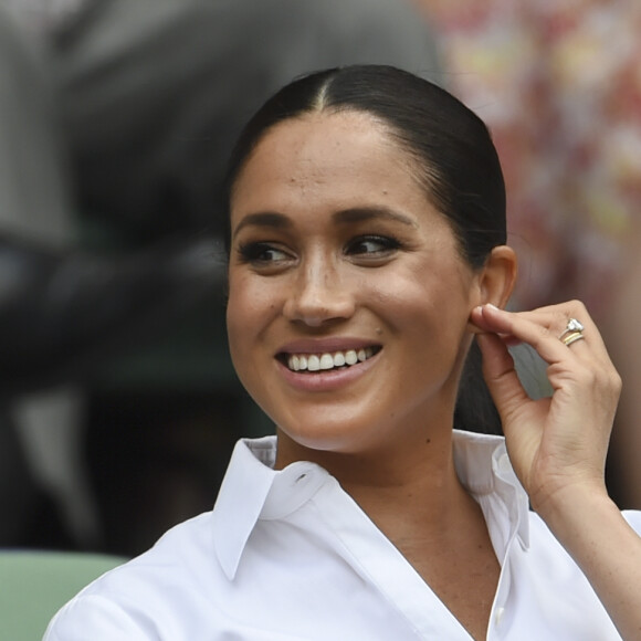 Catherine (Kate) Middleton, duchesse de Cambridge, Meghan Markle, duchesse de Sussex, et Pippa Middleton dans les tribunes lors de la finale femme de Wimbledon "Serena Williams - Simona Halep (2/6 - 2/6) à Londres, le 13 juillet 2019.