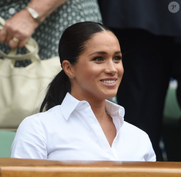 Catherine (Kate) Middleton, duchesse de Cambridge, Meghan Markle, duchesse de Sussex, et Pippa Middleton dans les tribunes lors de la finale femme de Wimbledon "Serena Williams - Simona Halep (2/6 - 2/6) à Londres, le 13 juillet 2019.