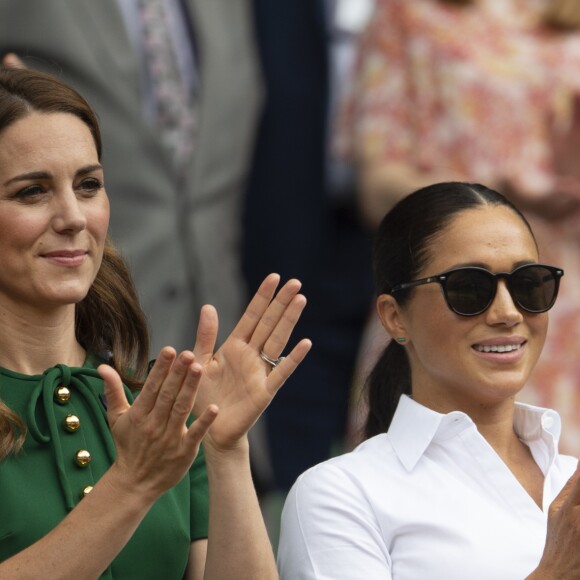 Catherine (Kate) Middleton, duchesse de Cambridge, Meghan Markle, duchesse de Sussex, et Pippa Middleton dans les tribunes lors de la finale femme de Wimbledon "Serena Williams - Simona Halep (2/6 - 2/6) à Londres, le 13 juillet 2019.