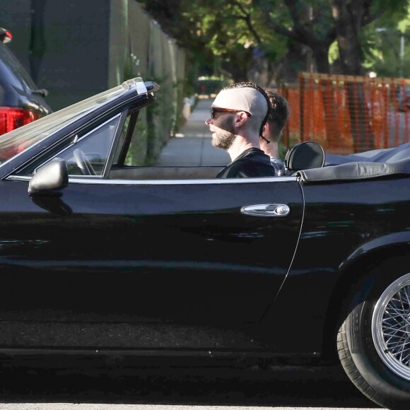 Exclusif - Adam Levine au volant de sa Ferrari à Los Angeles, le 24 septembre 2019.