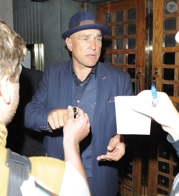 Jason Statham et Vinnie Jones sortent du restaurant "Ivy" à Londres, le 4 août 2014.
