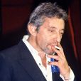  Archives - Serge Gainsbourg fumant une cigarette. Février 1984. 