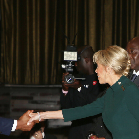 Brigitte Macron, Première dame et son mari Emmanuel Macron, président de la République française, Didier Drogba - Déplacement en Côte d'Ivoire - Dîner d'Etat offert par le président de la République de Côte d'Ivoire et sa femme en l'honneur du président de la République française et sa femme au Sofitel Hôtel Ivoire à Abidjan le 21 décembre 2019. © Dominique Jacovides / Bestimage