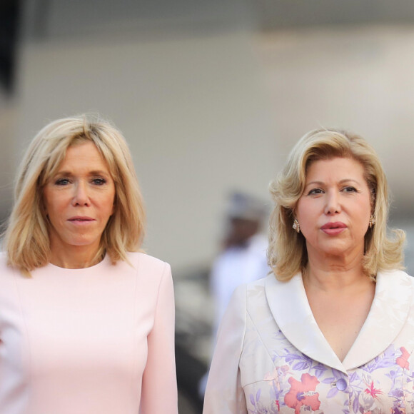 Dominique Ouattara, Première dame de Côte d'Ivoire, Brigitte Macron, Première dame de France - Déplacement en Côte d'Ivoire - Arrivée du Président de la République et de sa femme à l'aéroport international Félix Houphouët Boigny à Abidjan le 20 décembre 2019. © Dominique Jacovides / Bestimage