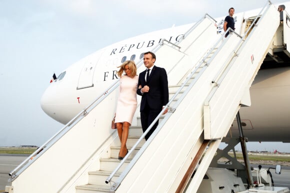 Brigitte Macron, Première dame et son mari Emmanuel Macron, président de la République française - Déplacement en Côte d'Ivoire - Arrivée du Président de la République et de sa femme à l'aéroport international Félix Houphouët Boigny à Abidjan le 20 décembre 2019. © Dominique Jacovides / Bestimage