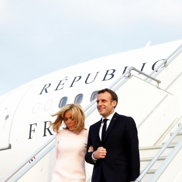 Brigitte Macron, Première dame et son mari Emmanuel Macron, président de la République française - Déplacement en Côte d'Ivoire - Arrivée du Président de la République et de sa femme à l'aéroport international Félix Houphouët Boigny à Abidjan le 20 décembre 2019. © Dominique Jacovides / Bestimage