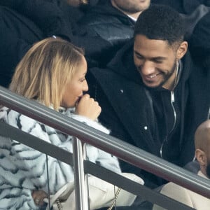 Tony Yoka et sa femme Estelle Mossely (enceinte de son deuxième enfant) de nouveau ensemble dans les tribunes lors du match de Ligue 1 opposant le Paris Saint-Germain à l'AS Monaco au Parc des Princes à Paris, France, le 12 janvier 2020. Le PSG fait match nul face à l'AS Monaco (3-3).