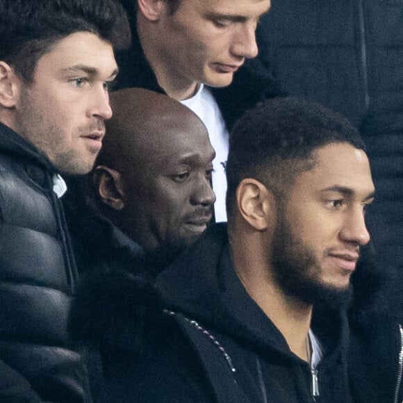 Tony Yoka et sa femme Estelle Mossely (enceinte de son deuxième enfant) de nouveau ensemble dans les tribunes lors du match de Ligue 1 opposant le Paris Saint-Germain à l'AS Monaco au Parc des Princes à Paris, France, le 12 janvier 2020. Le PSG fait match nul face à l'AS Monaco (3-3).