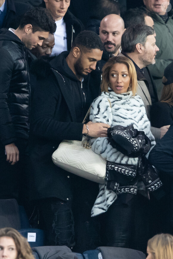 Tony Yoka et sa femme Estelle Mossely (enceinte de son deuxième enfant) de nouveau ensemble dans les tribunes lors du match de Ligue 1 opposant le Paris Saint-Germain à l'AS Monaco au Parc des Princes à Paris, France, le 12 janvier 2020. Le PSG fait match nul face à l'AS Monaco (3-3).