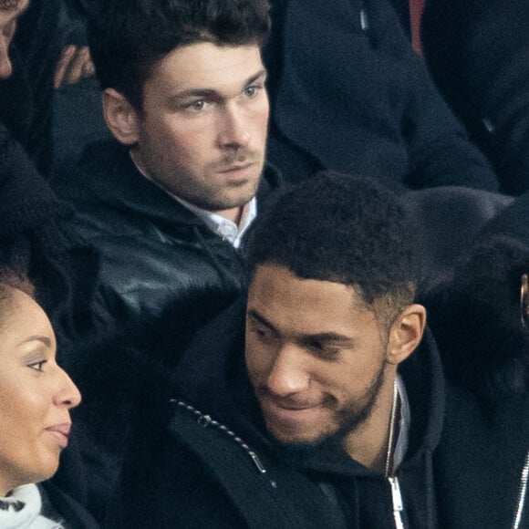 Tony Yoka et sa femme Estelle Mossely (enceinte de son deuxième enfant) de nouveau ensemble dans les tribunes lors du match de Ligue 1 opposant le Paris Saint-Germain à l'AS Monaco au Parc des Princes à Paris, France, le 12 janvier 2020. Le PSG fait match nul face à l'AS Monaco (3-3).