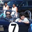 Johnny Hallyday accompagné de Maxim Nucci (Yodelice), arrive au restaurant "Soho House" à Malibu, au volant de son cabriolet AC Cobra marqué de son chiffre porte-bonheur, le numéro 7, Malibu, le 09 mars 2017.
