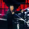 Robbie Williams et Lous and The Yakuza (Marie Pierra), stars de la finale de l'émission "X-Factor" en Italie. Milan. Le 12 décembre 2019. Robbie Williams a présenté un extrait de son album de Noël et a chanté avec les quatre finalistes du concours.