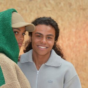 Tina Kunakey (Cassel) et son frère Zakari Kunakey assistent au défilé Lacoste, collection prêt-à-porter automne-hiver 2020-2021 au Tennis Club de Paris. Paris, le 3 mars 2020. © Veeren Ramsamy-Christophe Clovis /Bestimage