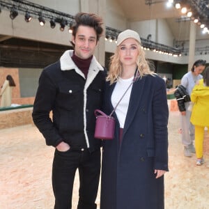 Félix Cordier et Chloé Jouannet assistent au défilé Lacoste, collection prêt-à-porter automne-hiver 2020-2021 au Tennis Club de Paris. Paris, le 3 mars 2020. © Veeren Ramsamy-Christophe Clovis /Bestimage