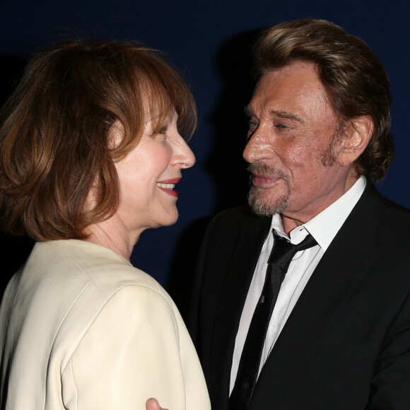 Nathalie Baye et Johnny Hallyday - Avant-première de "Salaud on t'aime" à l'UGC Normandie sur les Champs-Elysées à Paris le 31 mars 2014.
