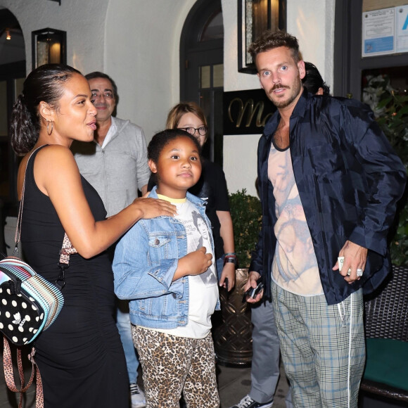 Christina Milian, enceinte, son compagnon Matt Pokora et sa fille Violet Madison sont allés dîner dans le restaurant Madeo à Beverly Hills, le 8 août 2019.