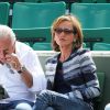 Dominique Strauss Kahn et Myriam L'Aouffir dans les tribunes des Internationaux de France de tennis de Roland Garros le 30 mai 2015.