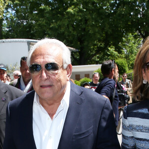 Dominique Strauss Kahn et Myriam L'Aouffir aux Internationaux de France de tennis de Roland Garros le 30 mai 2015.