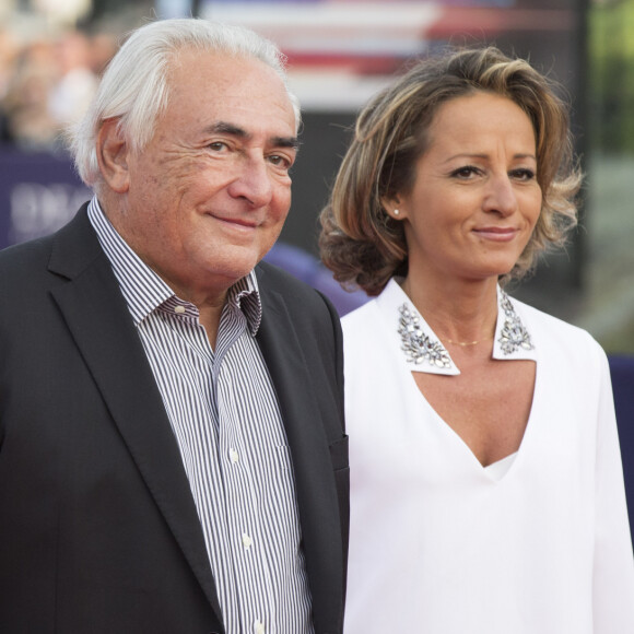 Dominique Strauss-Kahn et Myriam L'Aouffir - Avant-première du film "Sin City" lors du 40ème festival du cinéma américain de Deauville, le 13 septembre 2014.