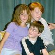 Daniel Radcliffe, Emma Watson et Rupert Grint en conférence de presse à Londres pour le film "Harry Potter à l'école des sorciers", en 2000.