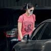 Exclusif - Nina Dobrev dans un parking de Los Angeles en tenue de sport chic : T-shirt Bob Marley / survêtemenrt mais sac à dos Louis Vuitton le 12 mai 2020.