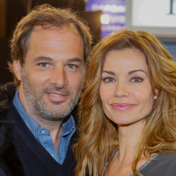 Ingrid Chauvin et son mari Thierry Peythieu au salon du livre à la porte de Versailles à Paris le 22 mars 2015.