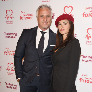 David Ginola et sa compagne Maeva Denat arrivent à la soirée "The Beating Hearts Ball" à Londres, le 27 février 2019.