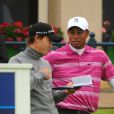 Camilo Villegas et Tiger Woods (en polo rose) en juillet 2010.