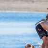 Exclusif - Hugh Jackman se balade sur la plage avec sa femme Deborra Lee Furness et ses chiens sous le soleil des Hamptons, le 25 juillet 2020